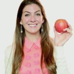 woman holding an apple