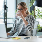 Business woman working at laptop