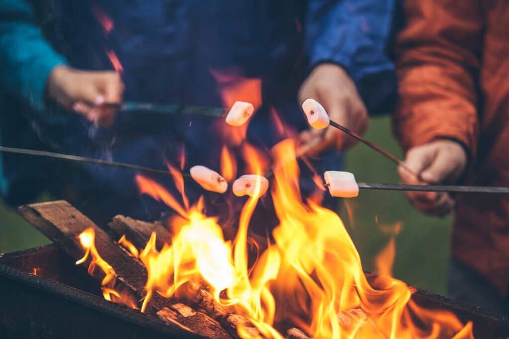 roasting marshmallows over a campfire for s'mores