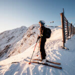 Mountaineer backcountry ski walking in the mountains.