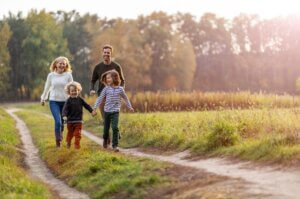 family hiking at dusk together outdoor activities with kids