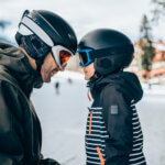 Father and son on winter mountain vacation