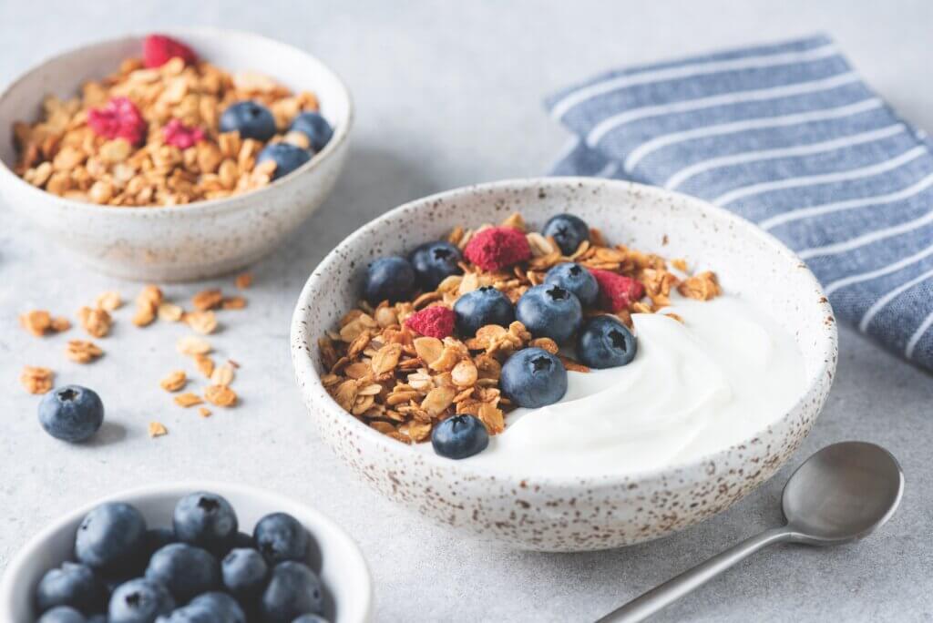 Yogurt bowl with granola and blueberries. Healthy breakfast or snack, rich in protein, fiber and calcium healthy summer recipes
